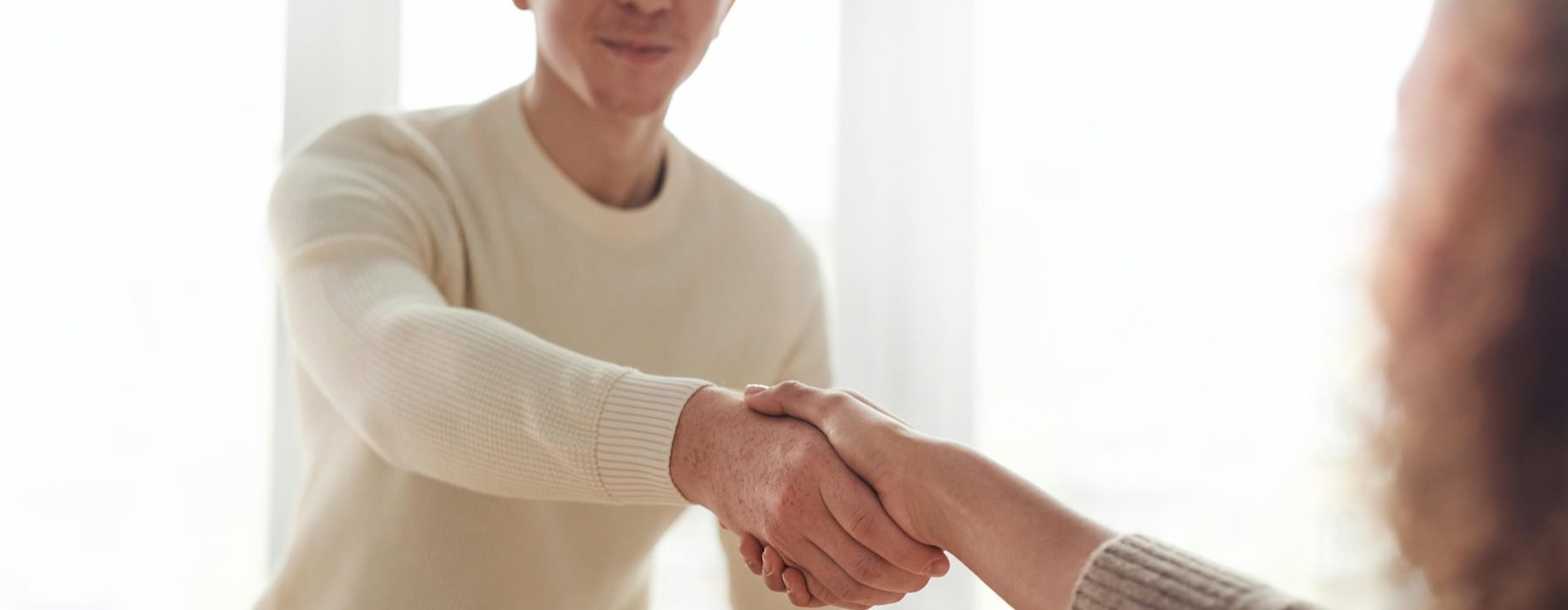 two people shaking hands